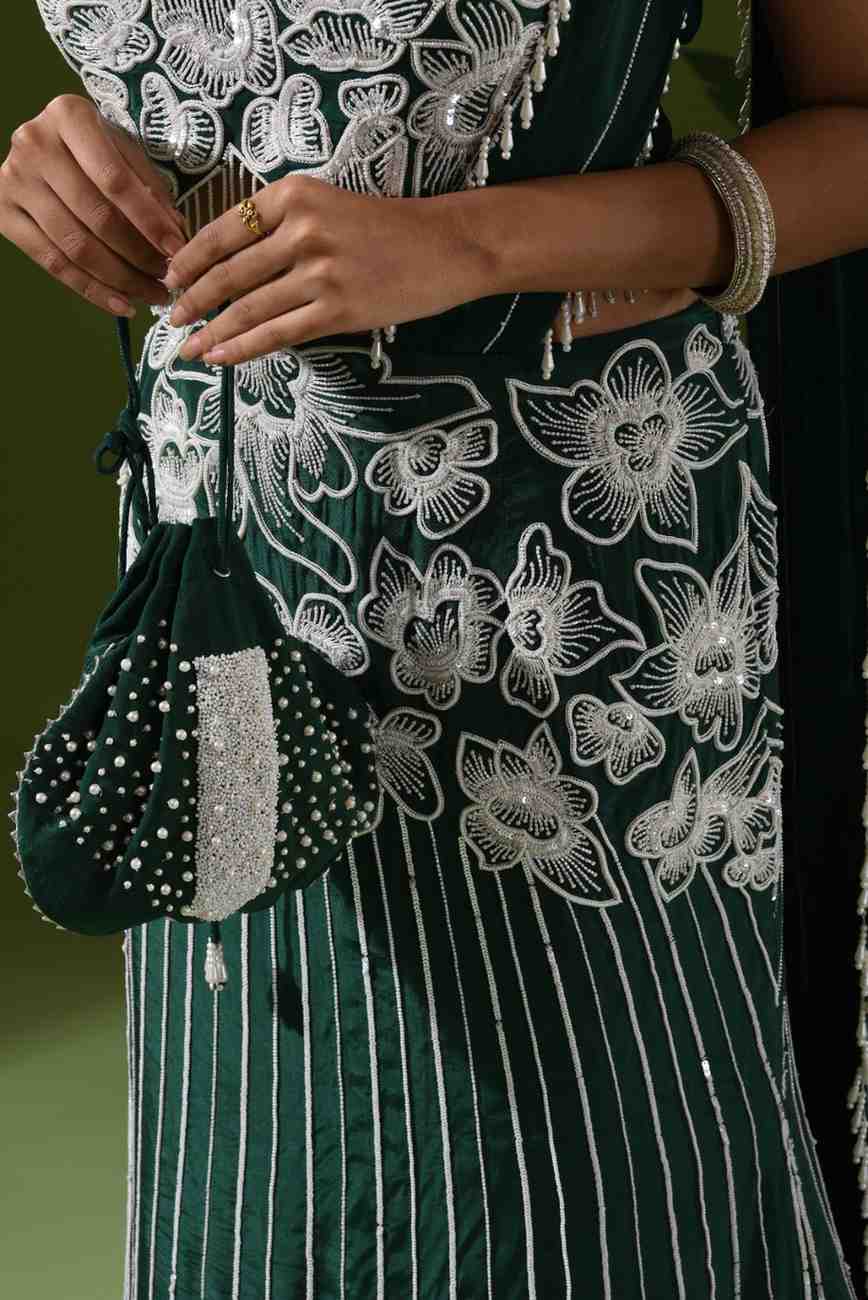 Heavy embroidered mermaid lehenga and potli bag