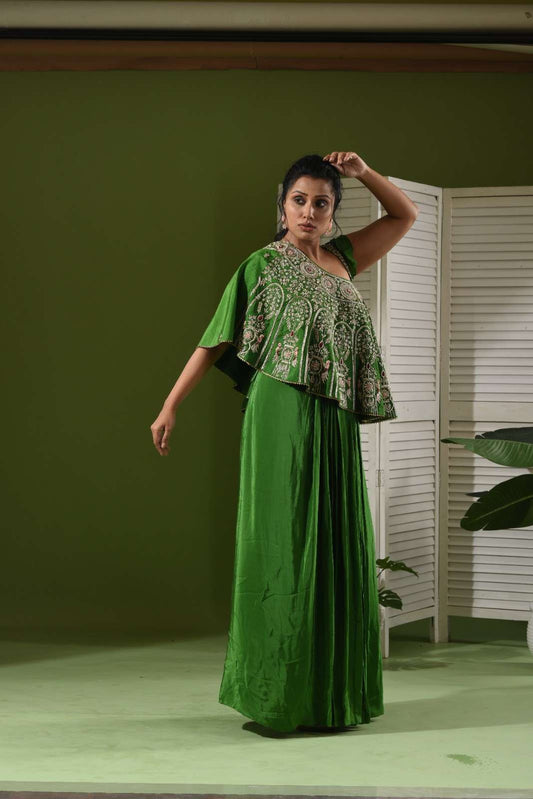One shoulder cape , bustier and pull up skirt