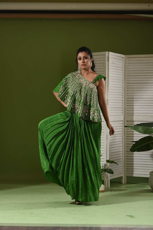 One shoulder cape , bustier and pull up skirt