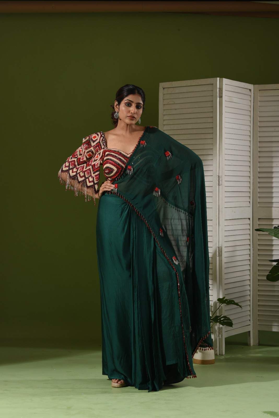One side heavy embroidered blouse, pull up skirt and drape