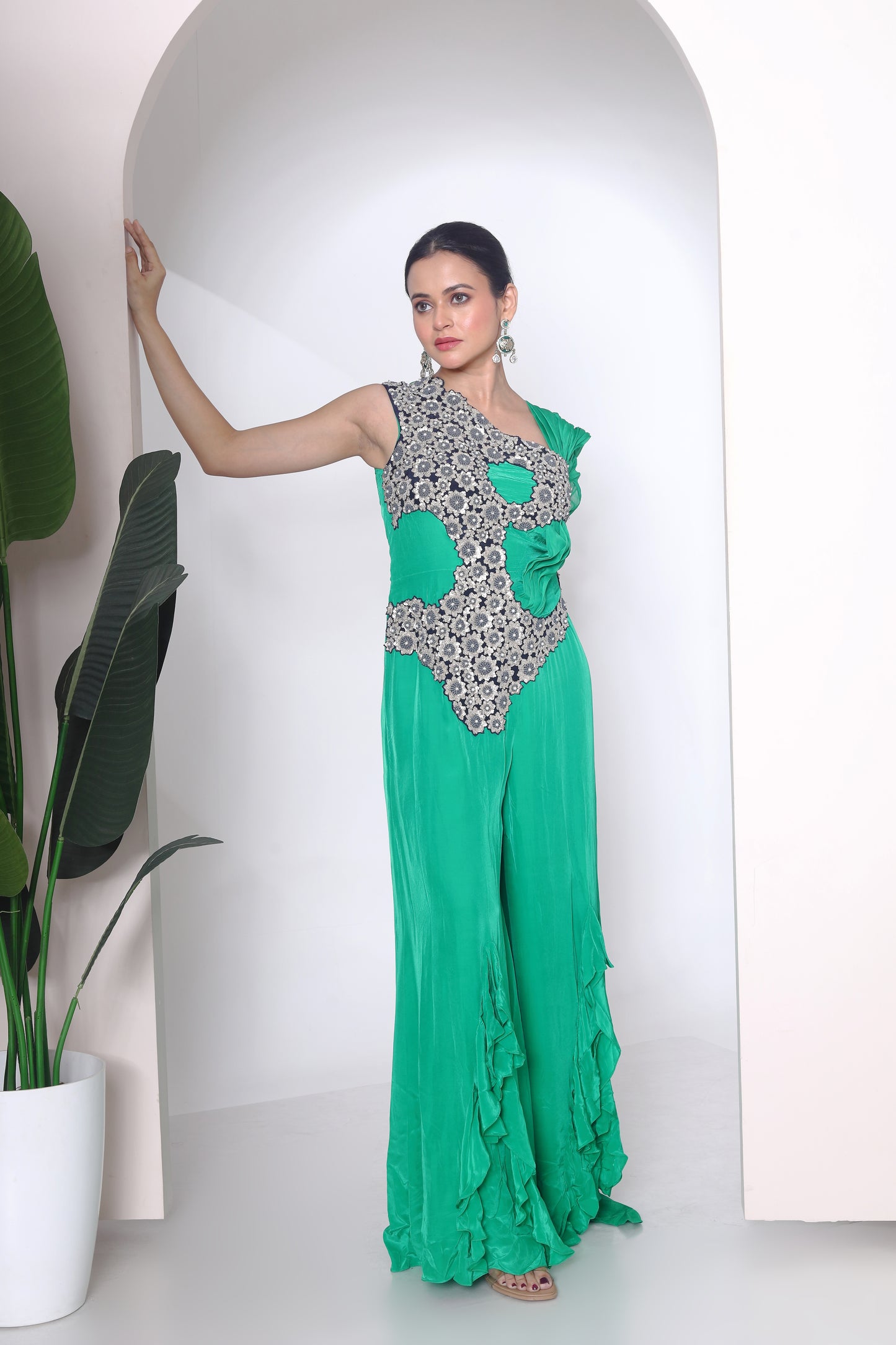 Green jumpsuit with embroidered panel