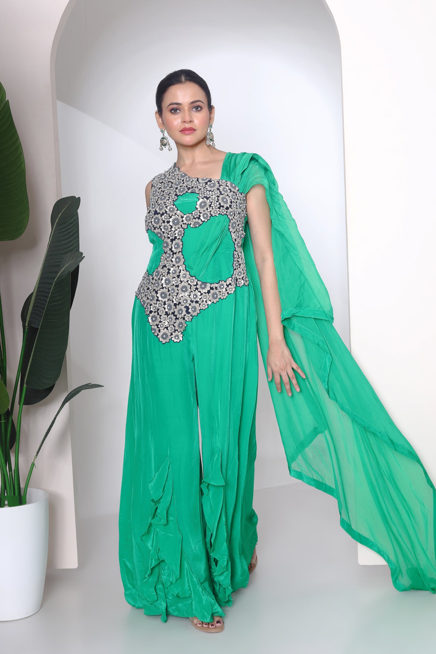 Green jumpsuit with embroidered panel