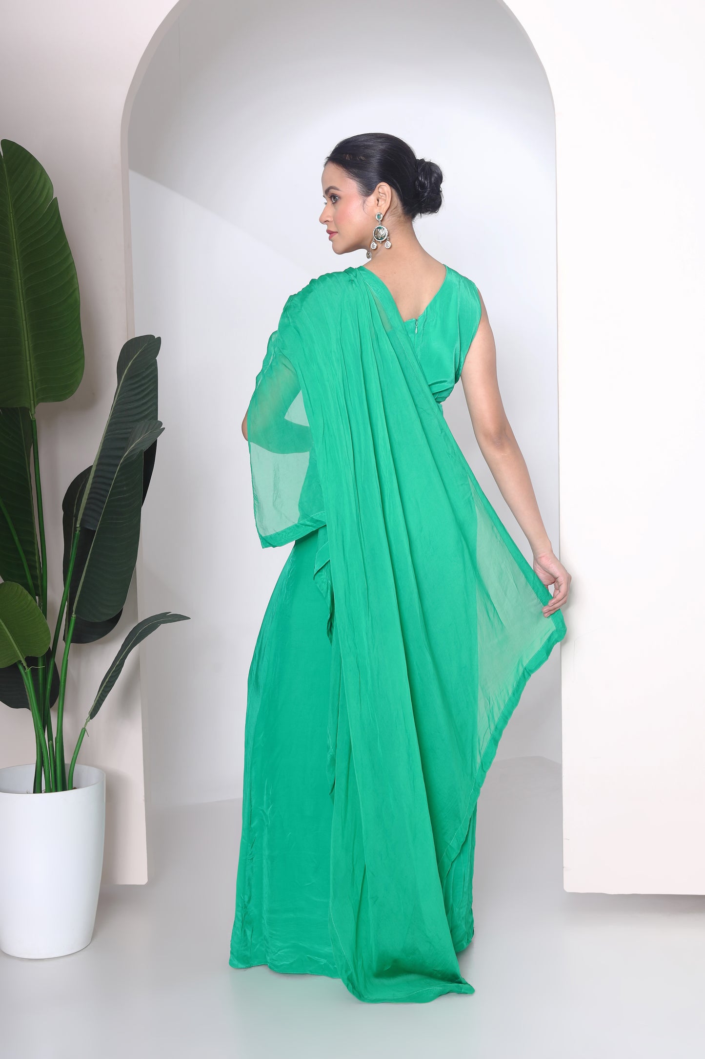 Green jumpsuit with embroidered panel